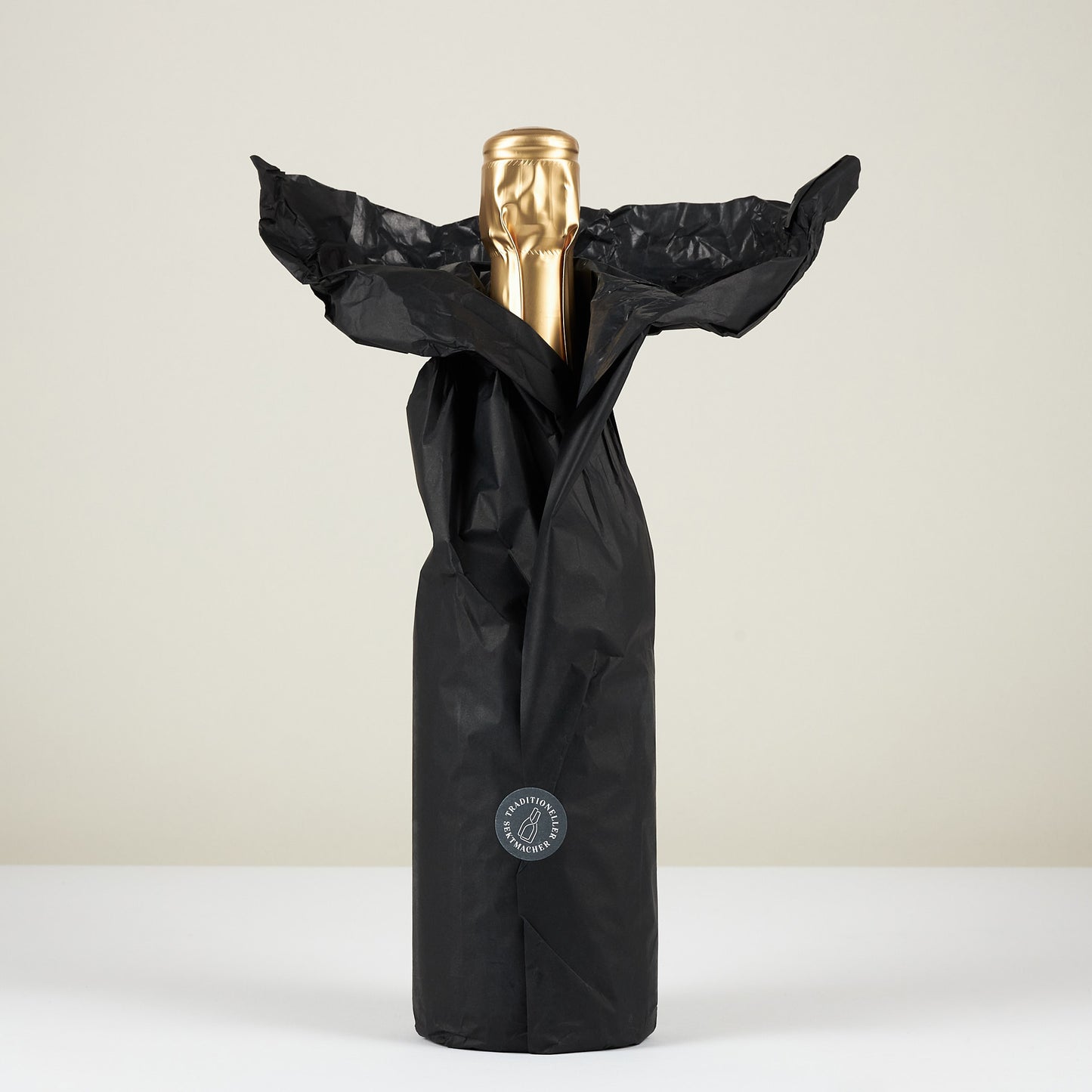 Schaumwein als Geschenk verpackt