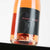Schaumweinflasche stehend, schwarzes Etikett mit Aufschrift: Pinot Rose Brut